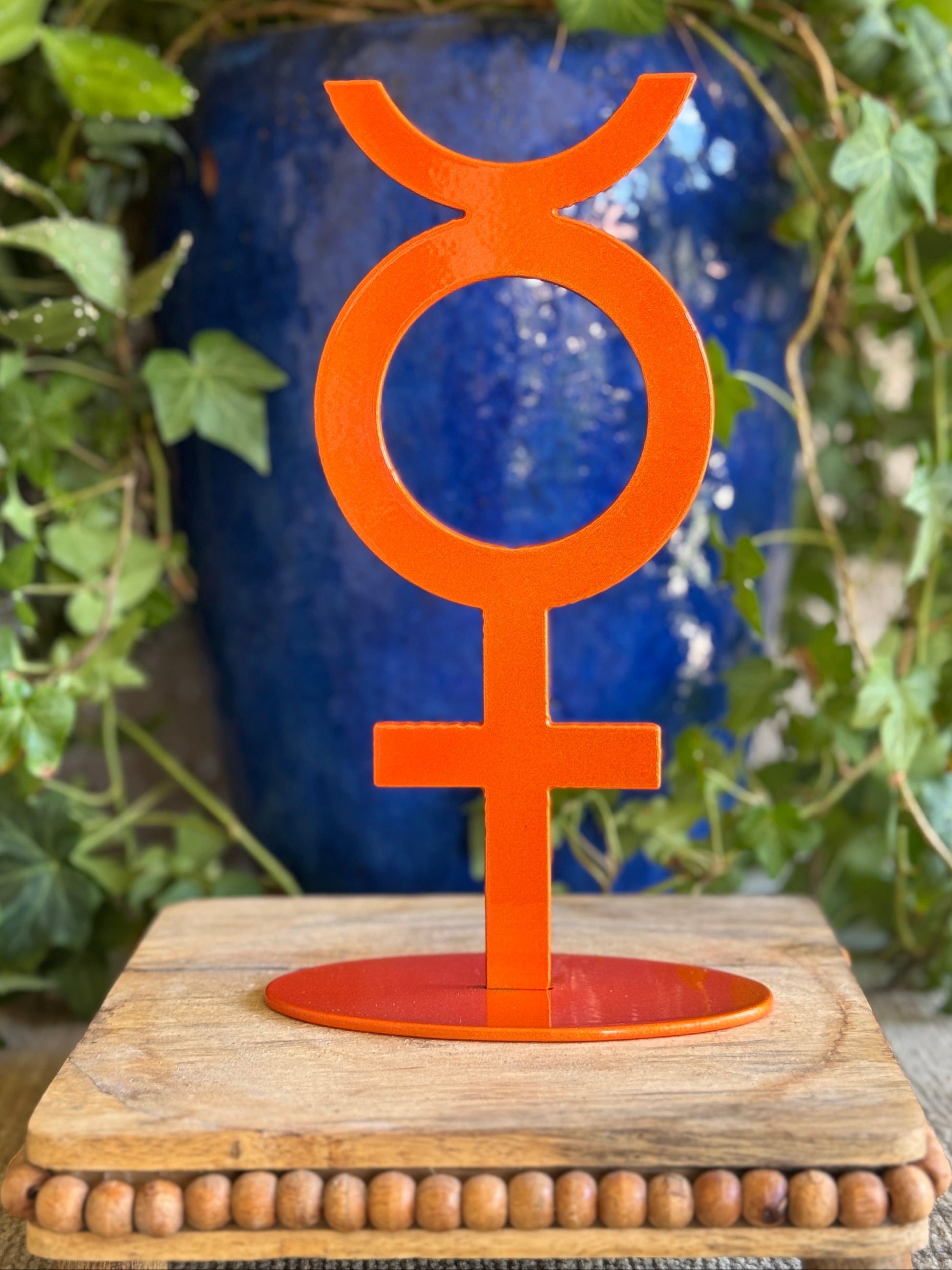 Mercury, orange on stand