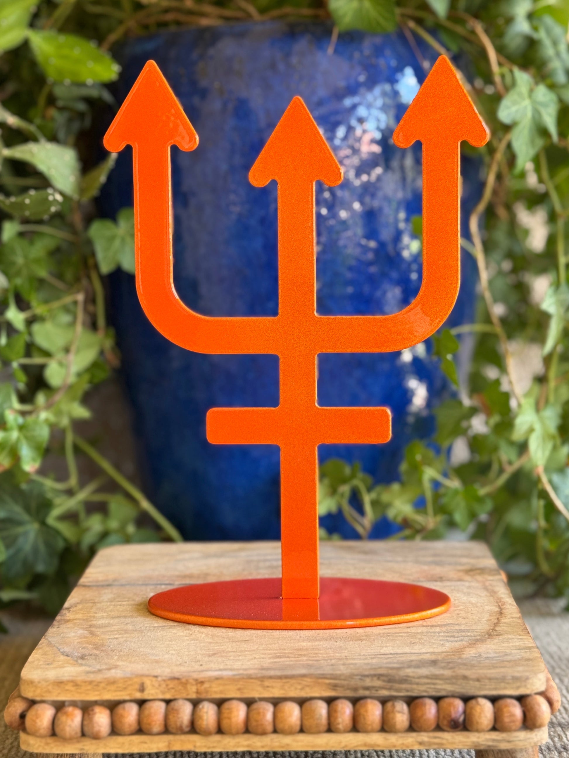 Neptune, orange metal statue