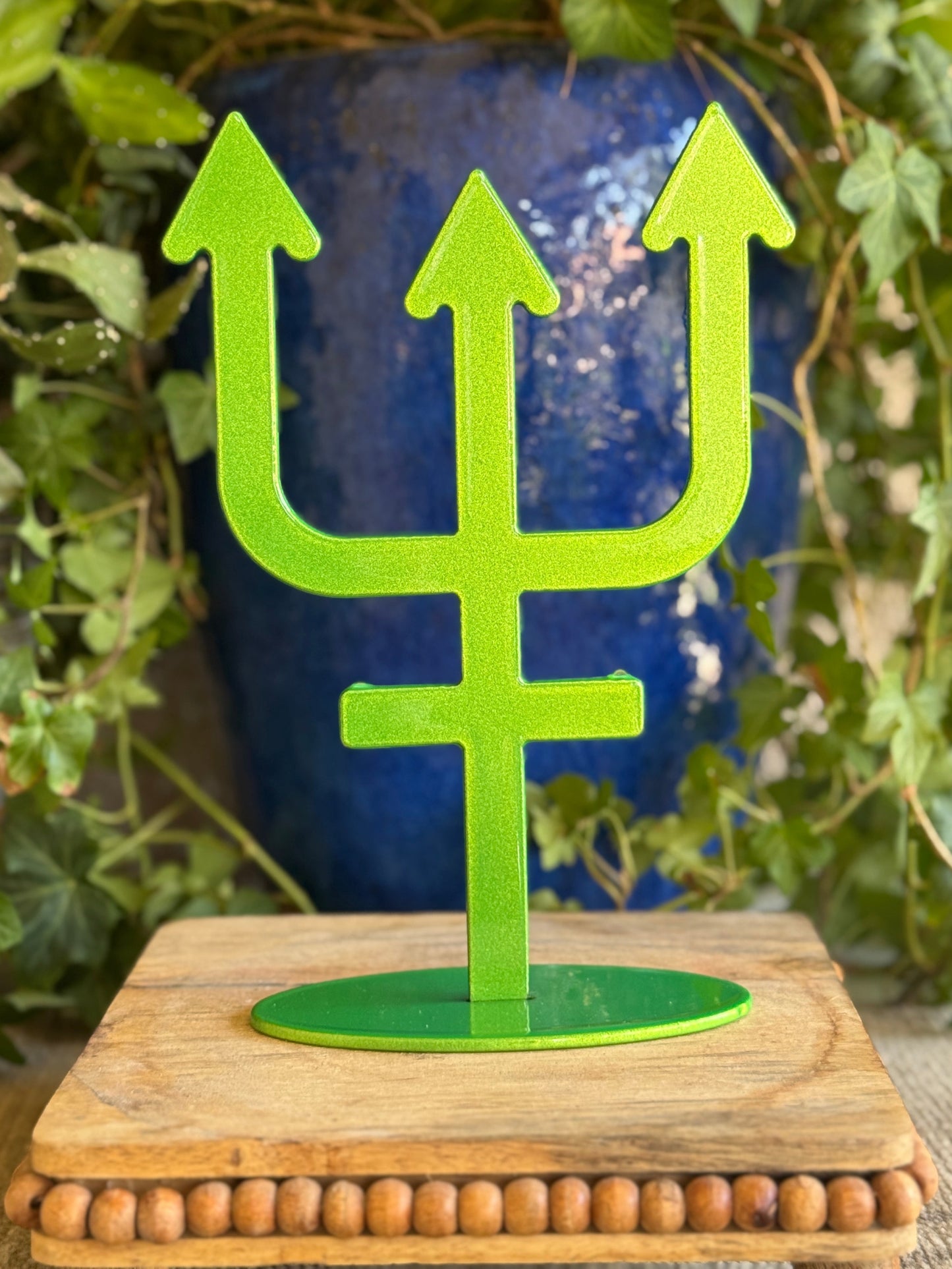 Neptune, green metal statue