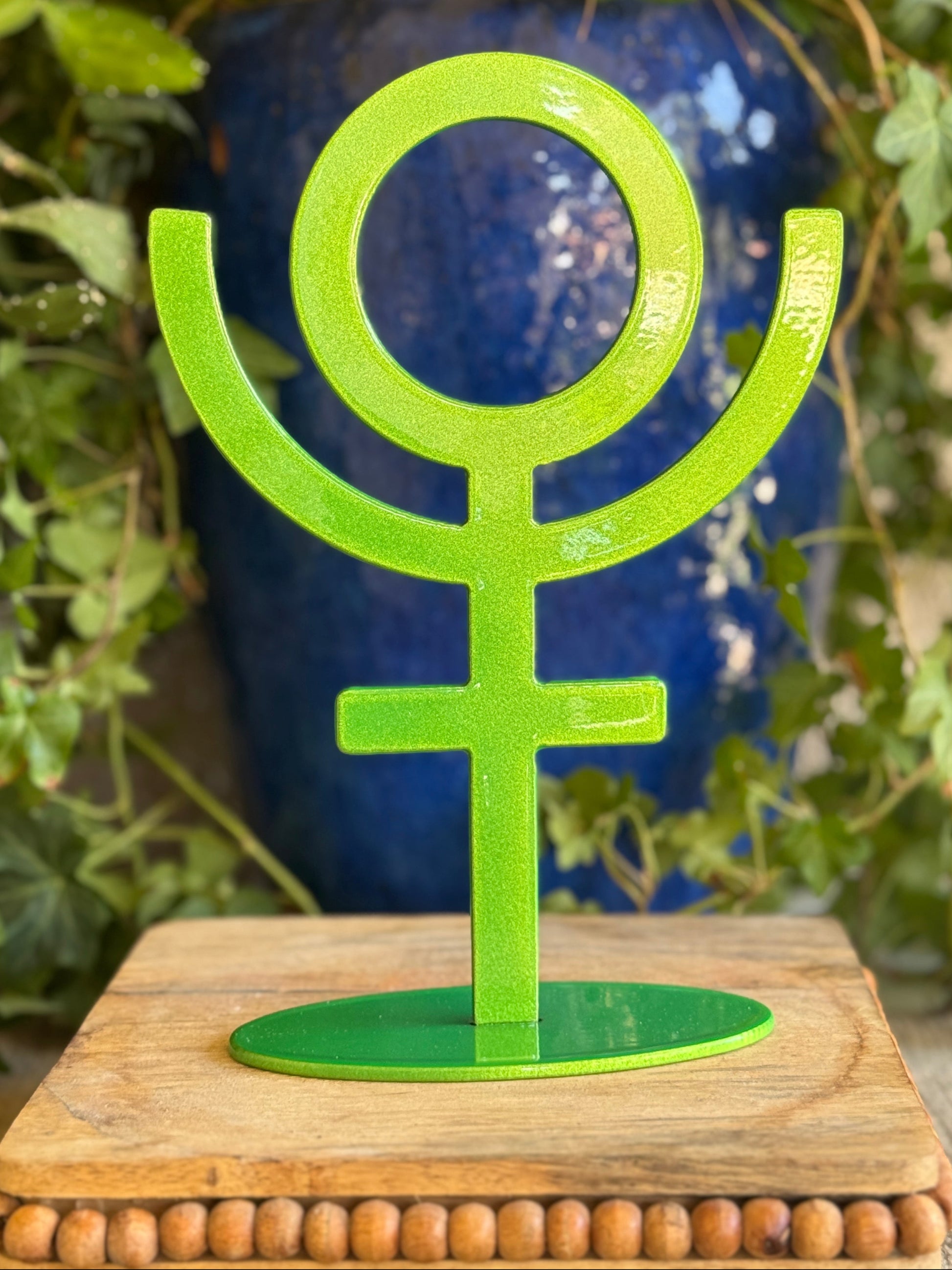 Pluto, green metal statue