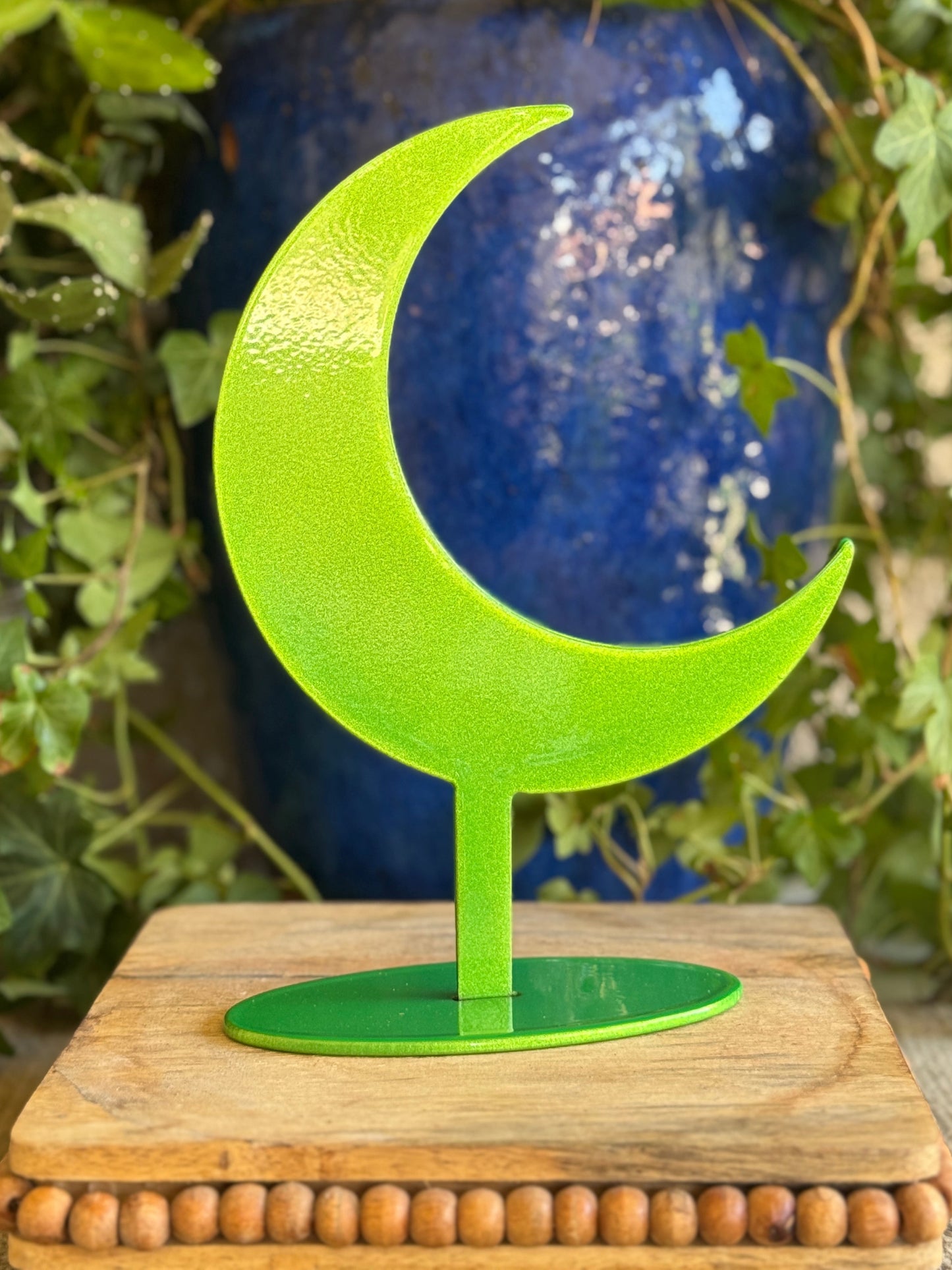 Moon, green on stand