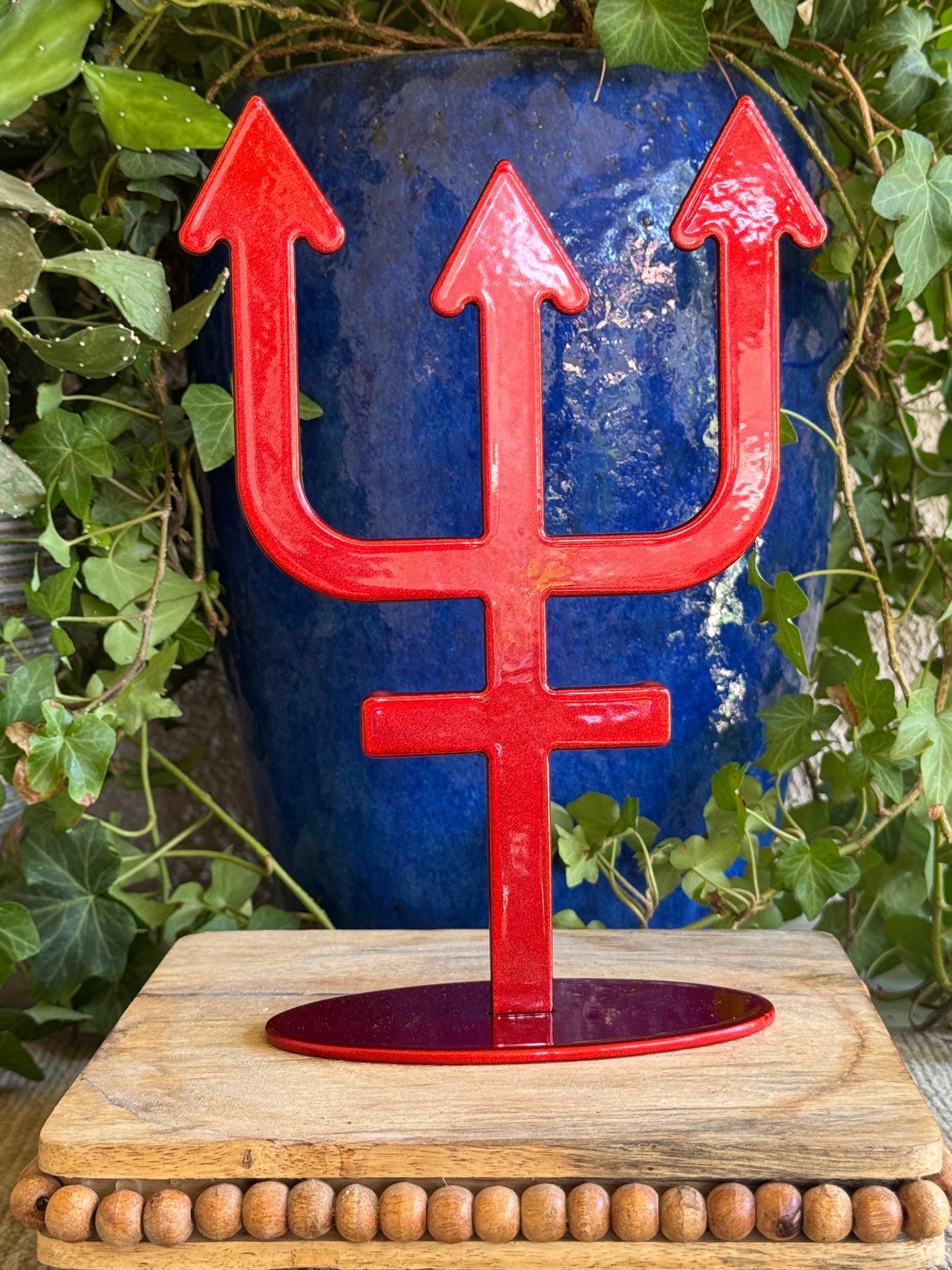 Nepture, red metal statue