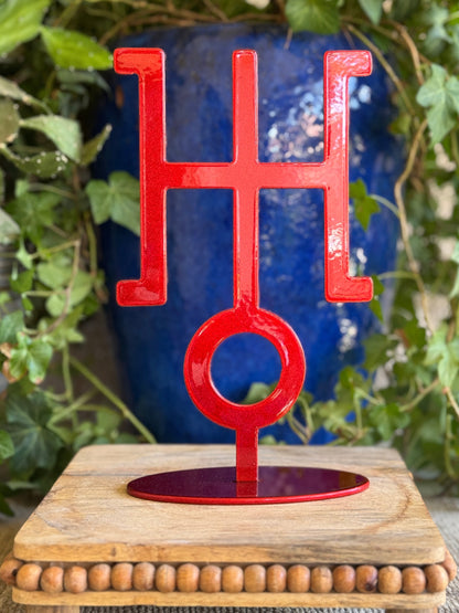 Uranus, red metal statue